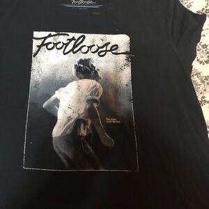 This is a black tee with the classic 80s Footloose logo.